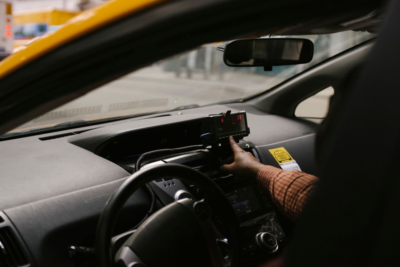 Crafting Captivating Headlines: Your awesome post title goes here Anonymous ethnic male driver with steering wheel using GPS navigator to search direction for drive on street in city during work